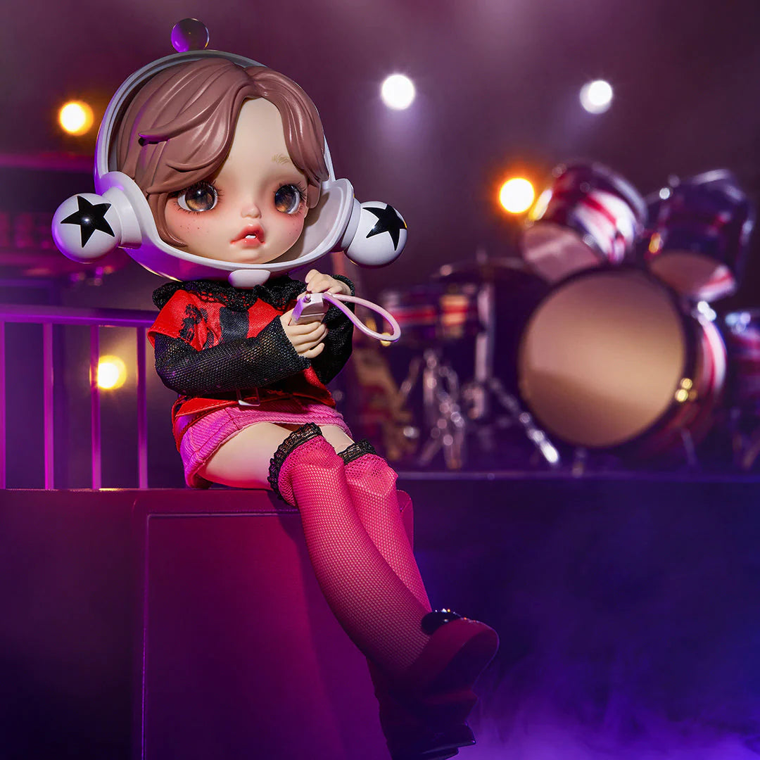 SKULLPANDA x NANA BJD Figure Doll perched on stage with bright lights, a white helmet, and a star ball nearby.