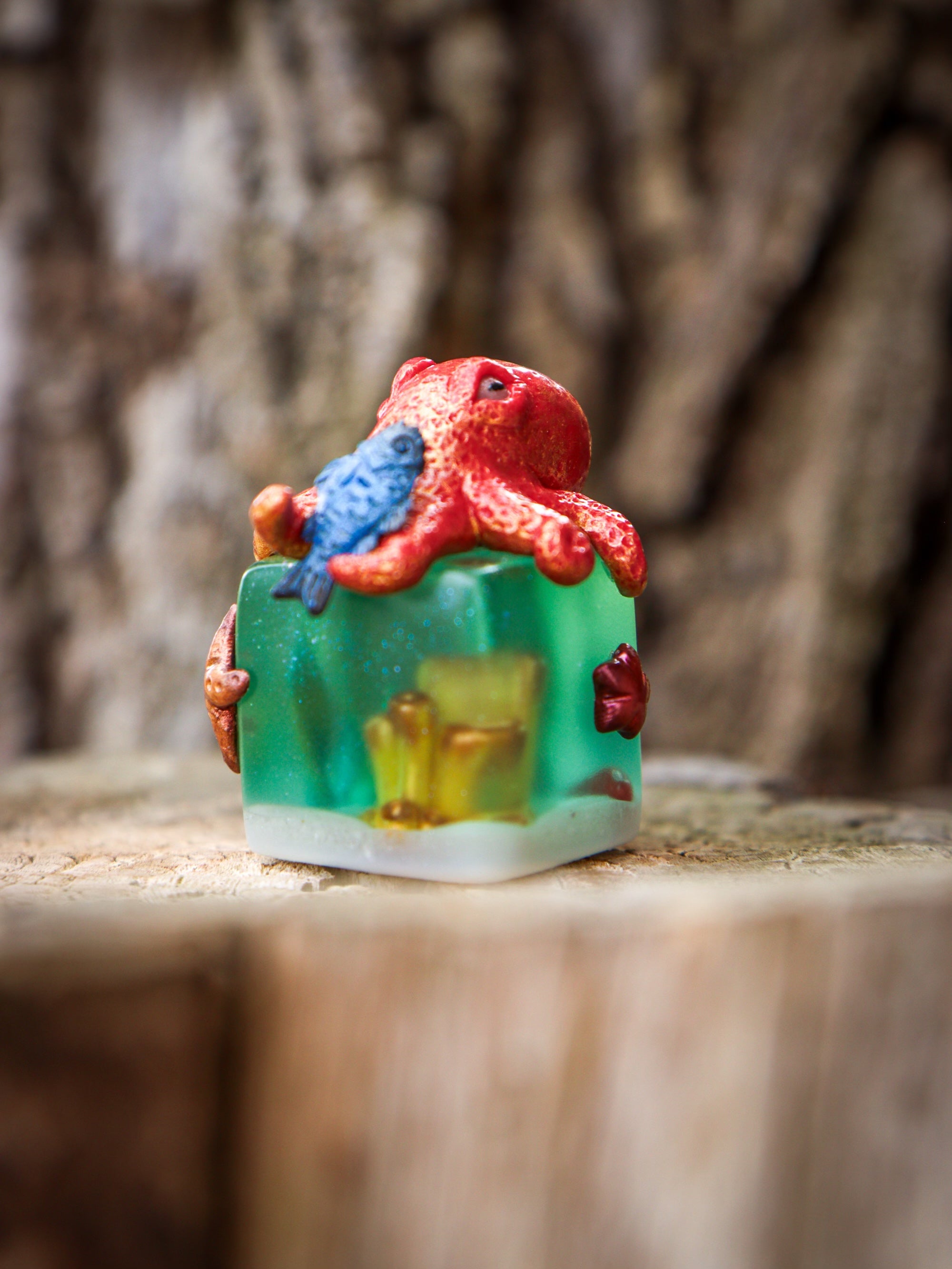 A blind box art toy: Little Shit Big Deal - CUBES by Fairies And Fancies. Sculpted by Dr. Polpz. Features a small red octopus, blue fish, and green cube.