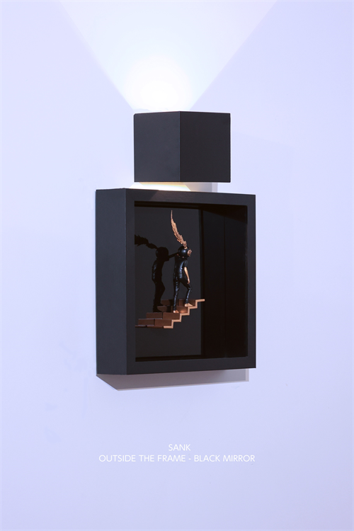 Sank - Outside the Frame: Minimalist wall-mounted art with a cubic lamp, shadow-box frame, tiny sculpted figure on copper stairs, and mirrored back panel.