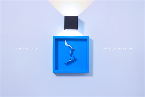 Sank - Outside the Frame: A blue figure ascends steps in a shadow box, holding a feather, illuminated by an overhead light. Preorder for Q4 2025.