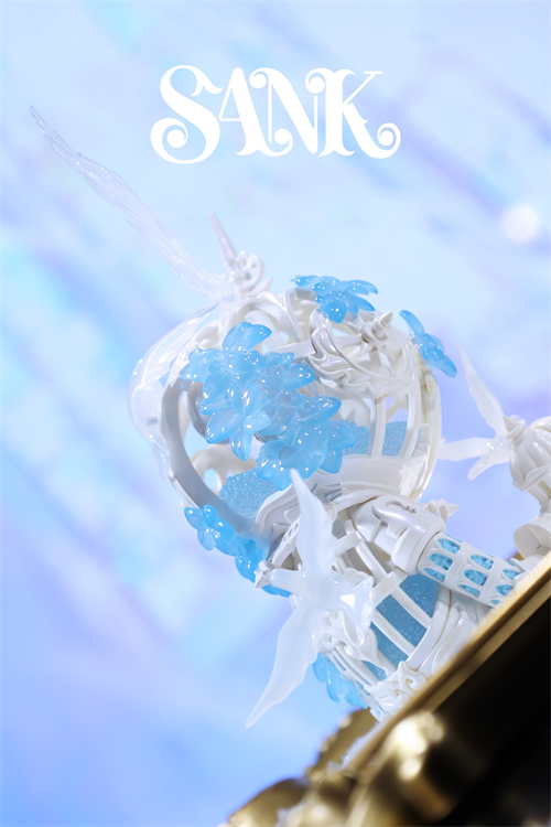 Good Night Series - Sky Wing sculpture features a white, filigree cage with blue floral clusters and white birds, set on a gold-toned base, limited edition resin piece.