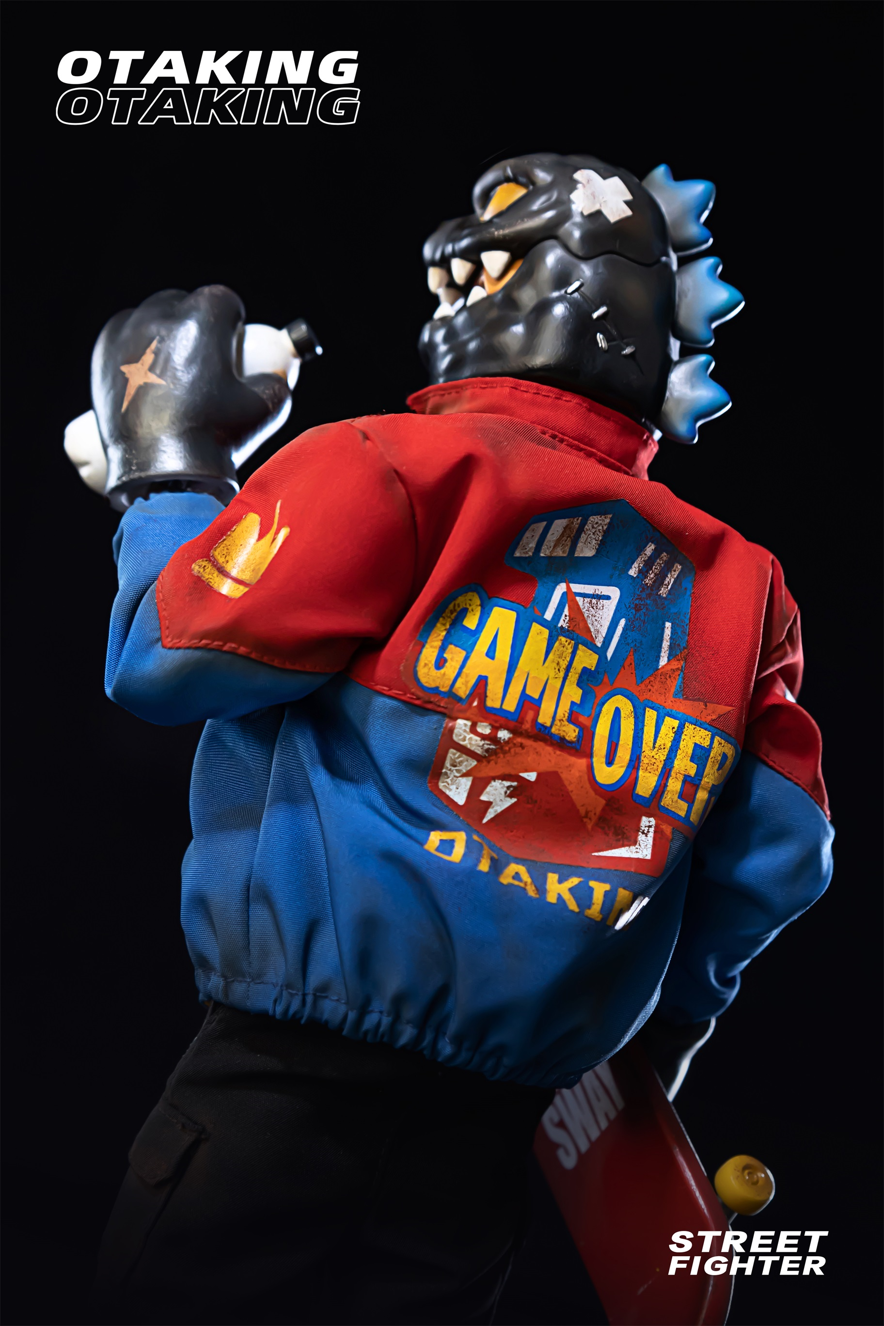 Person in superhero attire with mask, gloves, and logo. Close-up of toy and skateboard. Limited edition OTAKING - Street fighter product.