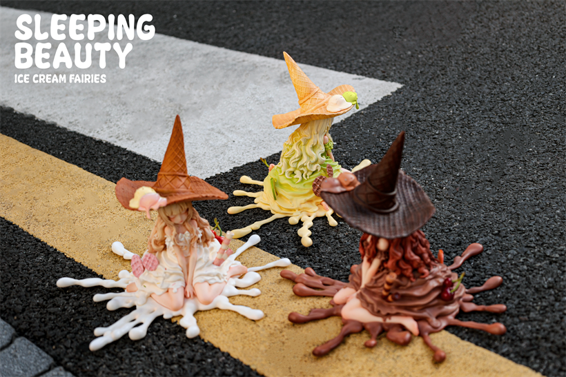 Sleeping Beauty-Ice Cream Fairies preorder: three resin fairies melting into ice cream puddles, each with waffle-cone hats, set on asphalt. Limited edition of 499.