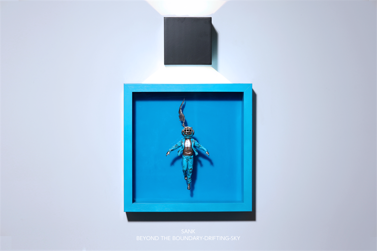 Sank-Beyond the Boundary-Drifting-Sky art piece, featuring a diver figure in a cyan shadow-box, with lamp; preorder for Q3 2026 delivery.
