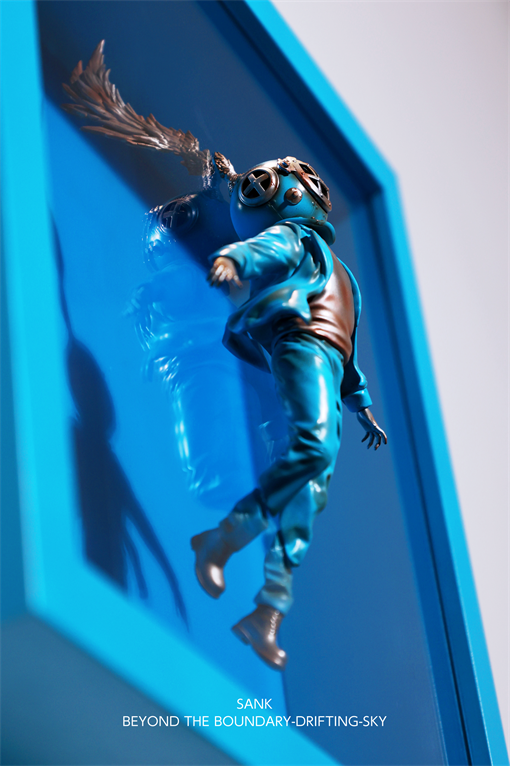 Sank-Beyond the Boundary-Drifting-Sky: A resin art figure in a diving helmet, suspended in a deep-blue frame, signed by artist SANK.