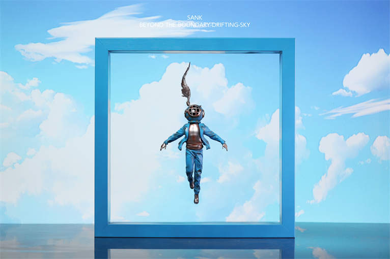 Sank-Beyond the Boundary-Drifting-Sky features a blue-clad figure in a diving helmet within a sky-themed portal. Preorder resin art toy from Strangecat Toys.