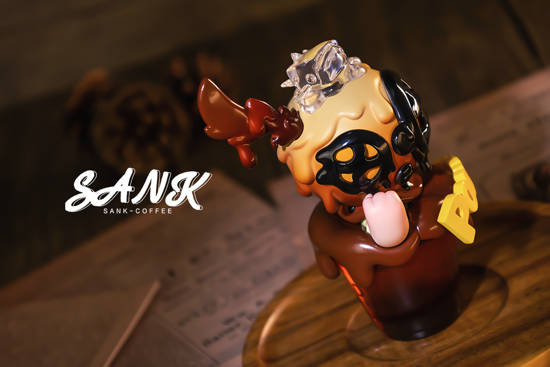 Alt text: Sank-Americano toy figurine on a table, limited edition, preorder for Aug 2024, made of PU Resin, includes a cup.