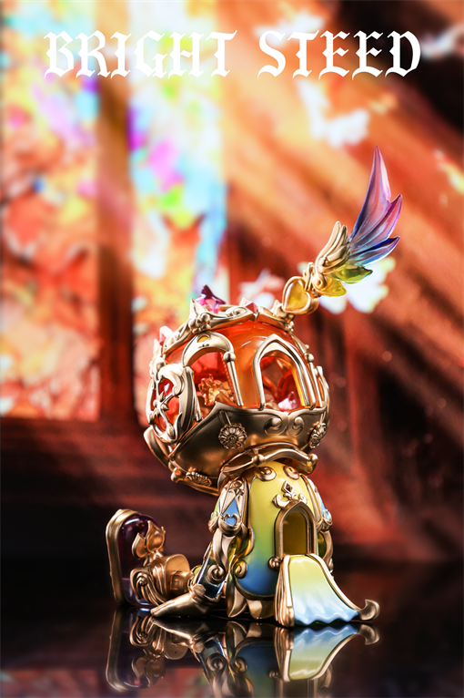 Good Night Series - Bright Steed - Golden Circle: A gold-tone, ornate knight’s helmet figurine with a red gem, rainbow wing, on reflective surface.