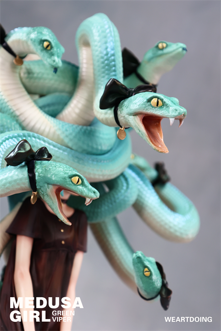 Medusa Girl-Green Viper art toy: a resin figure with snake hair adorned in bows and earrings, by illustrator Yoshioka. Limited edition preorder, Strangecat Toys exclusive.