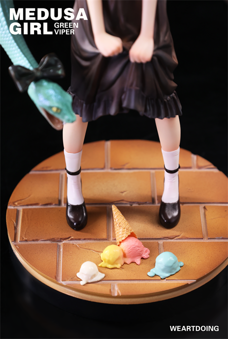 Medusa Girl-Green Viper figure in dark dress with snake and fallen ice cream, showcasing dark fairy-tale themes by artist Yoshioka for WEARTDOING.