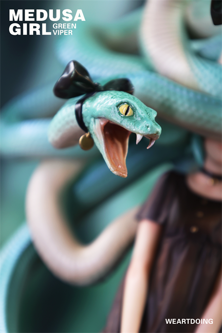 Close-up of Medusa Girl-Green Viper, featuring a viper hairpiece with a bow and open mouth, part of a limited edition resin figure by Yoshioka.