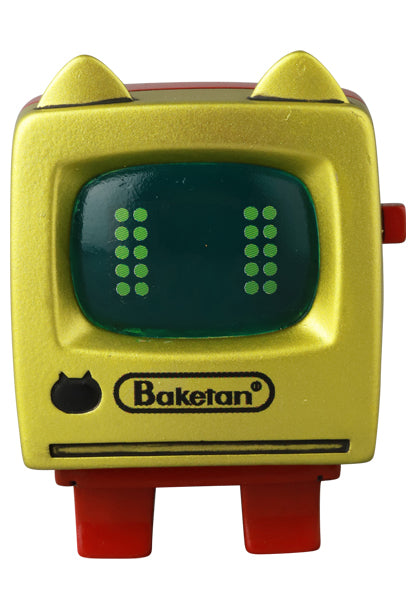 VAG SERIES 44 Baketan No. 2: A 2.5-inch vinyl toy pet with LED-dot eyes in a TV-shaped, gold-colored body, featuring red legs.