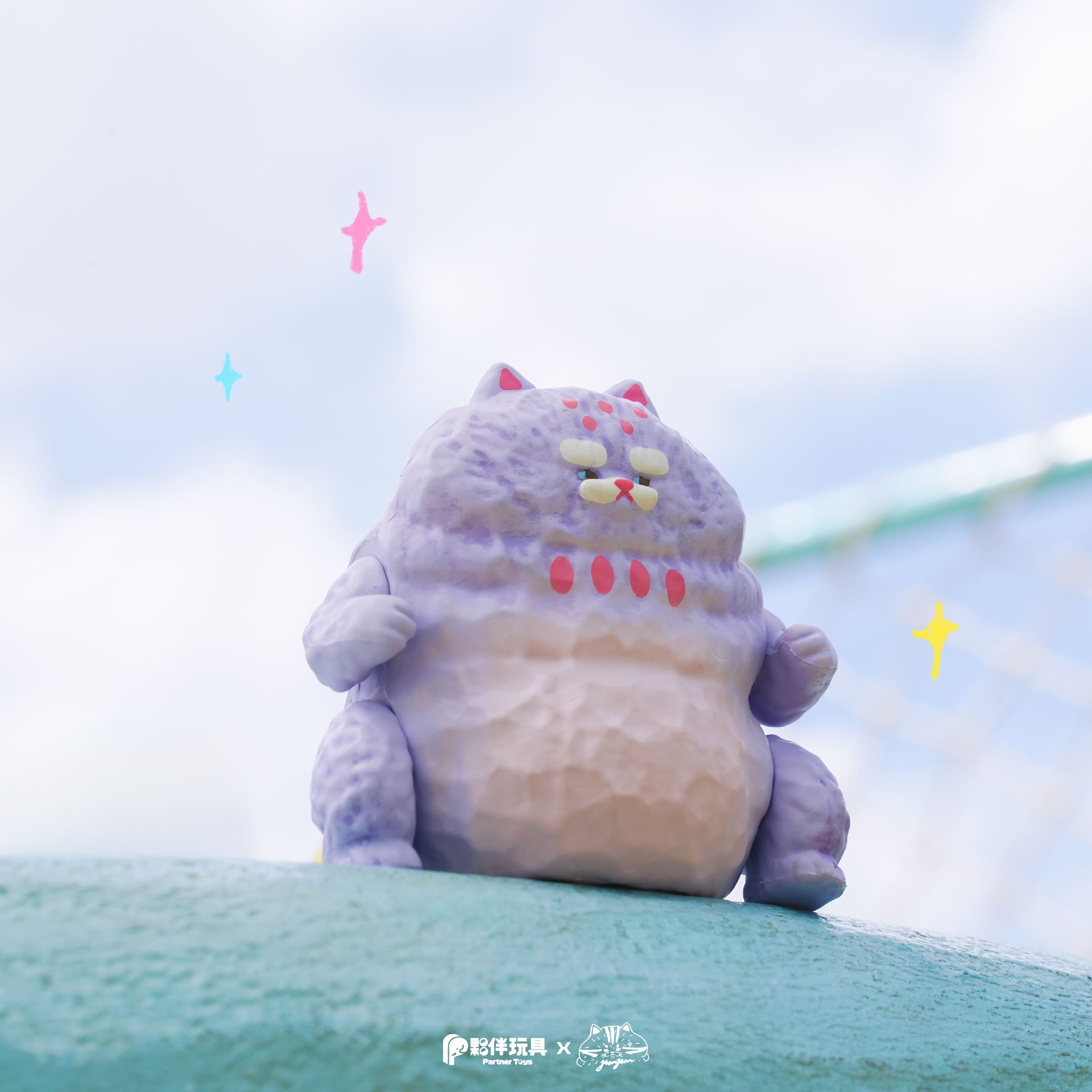 HanHanzoo - HanHan Dragon Blind Box: A chubby, lavender vinyl art cat figure with pink spots and half-closed eyes, part of a limited-edition collaboration.