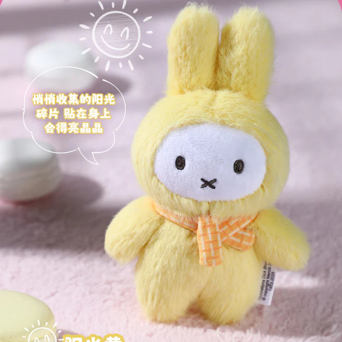 Miffy Macaron V2 Plush Keychain Blindbox features a yellow bunny with a checked scarf, part of a 6-design series.