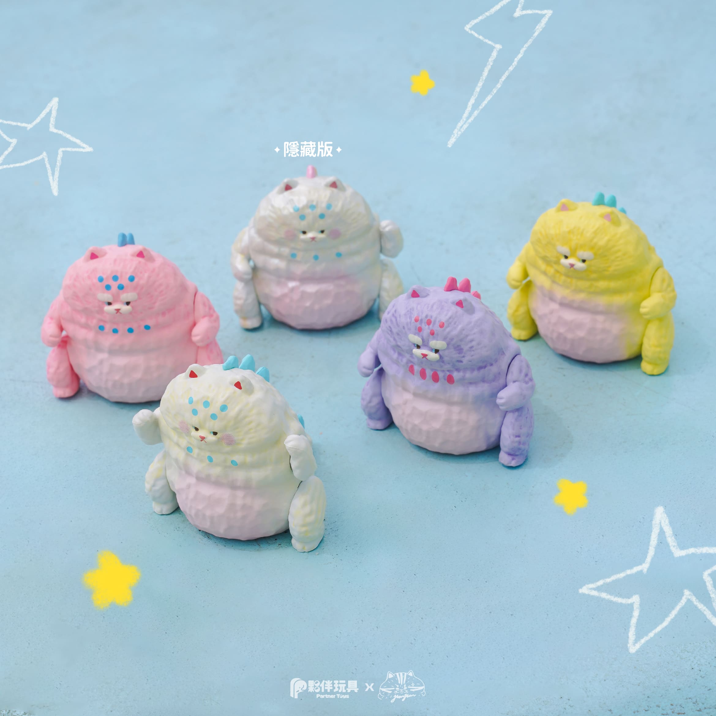 Five 'HanHanzoo - HanHan Dragon Blind Box' figures, textured vinyl toys with cat and dino features, including one iridescent edition, arranged on a pale blue surface.