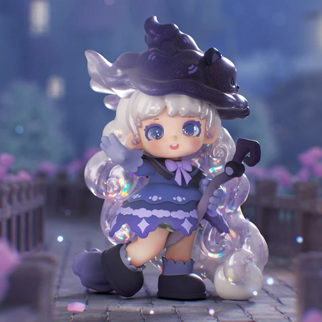 Chibi-style character from Miana The Sleeping Castle Series Blind Box, featuring a purple witch hat, bubble hair, wand, and whimsical outfit, on a magical backdrop.