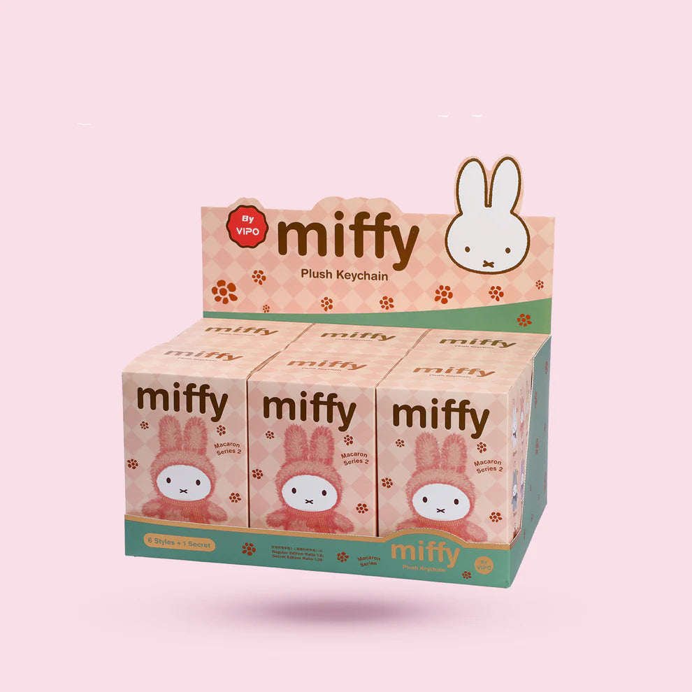 Miffy Macaron V2 Plush Keychain Blindbox: Counter display with six pastel-themed boxes featuring Miffy, offering six designs plus one secret, by VIPO.