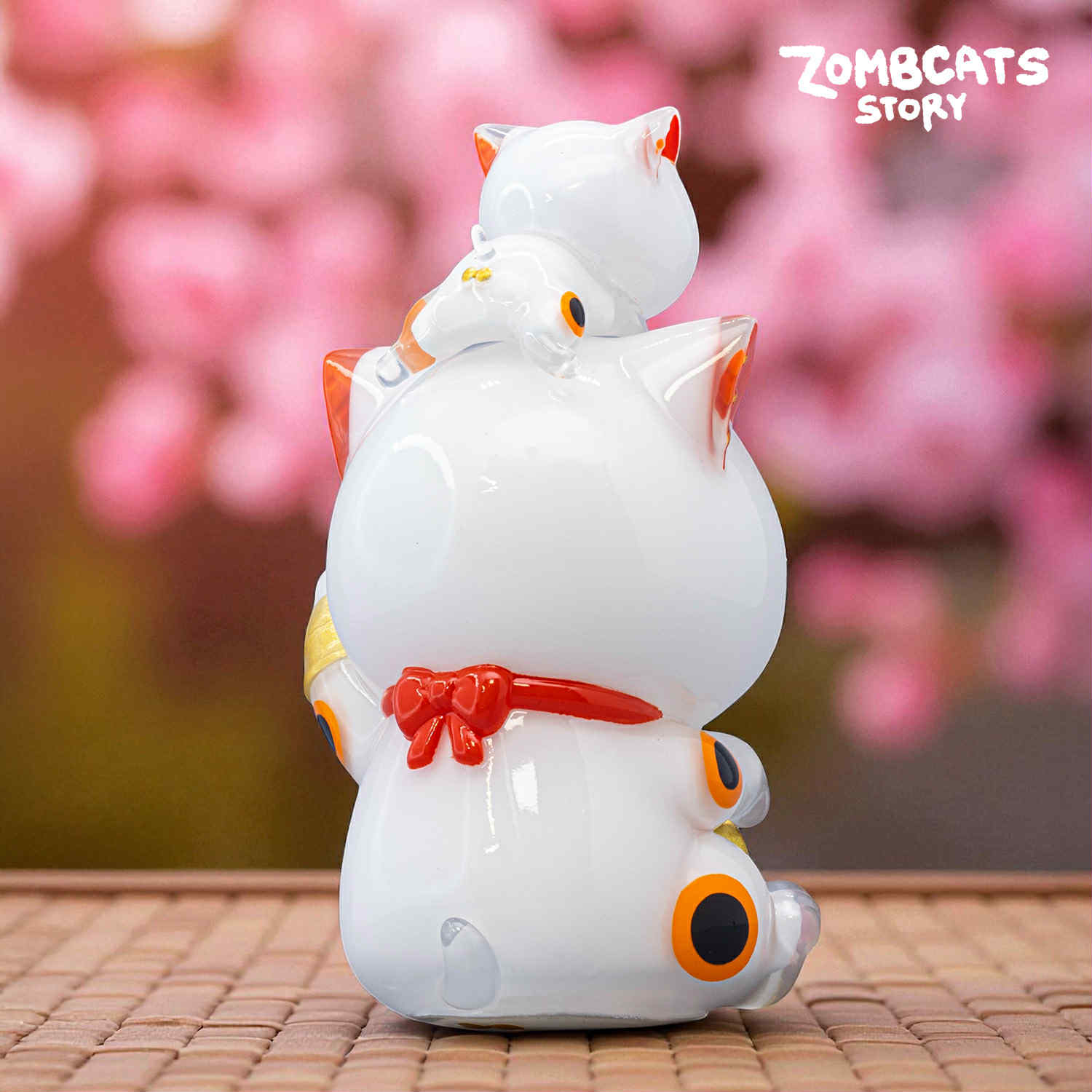 Zombcats Story - Grumpy Maneki LOTTERY: Glossy white ceramic figurine, classic lucky-cat pose, tiny kitten on head, preorder for Strangecat Toys' unique art toy collection.