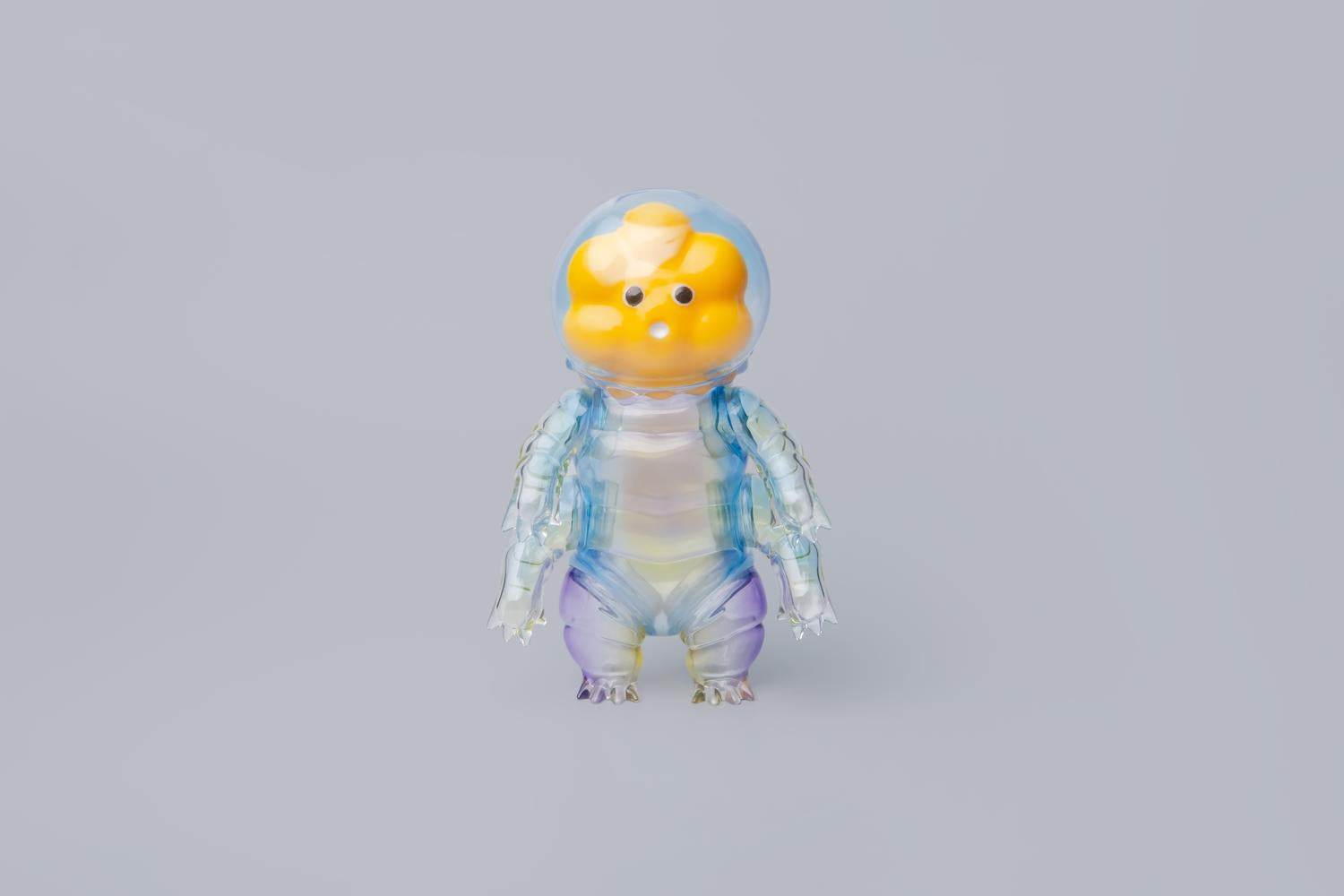 Water Bear - Diver by PPDAdventure: A 15 cm designer toy resembling a stylized tardigrade with a yellow flower-like face and clear, segmented body.