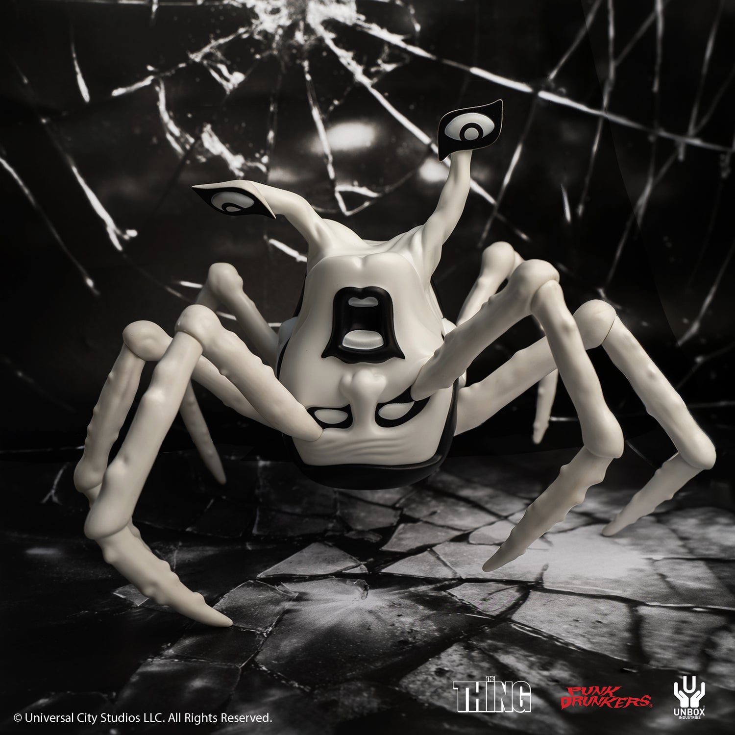 THE THING: PDS AITSU CHASE VARIANT HEAD - Preorder. A glossy white vinyl figure featuring eight legs and bold black accents, inspired by The Thing collaboration.