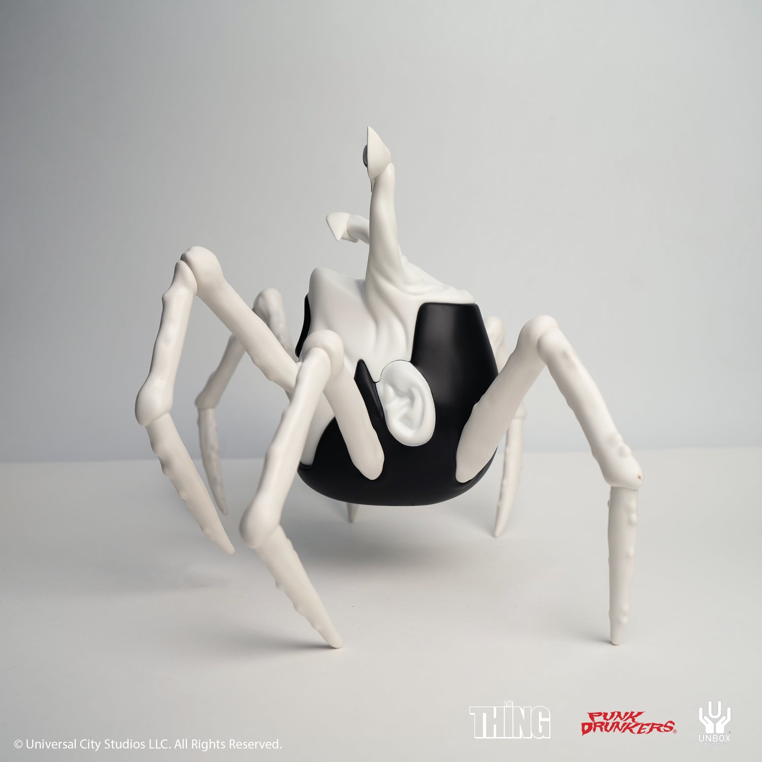 THE THING: PDS AITSU CHASE VARIANT HEAD - Preorder; spider-like art toy with matte-black body, white legs, glossy white top with ear and eyestalk.