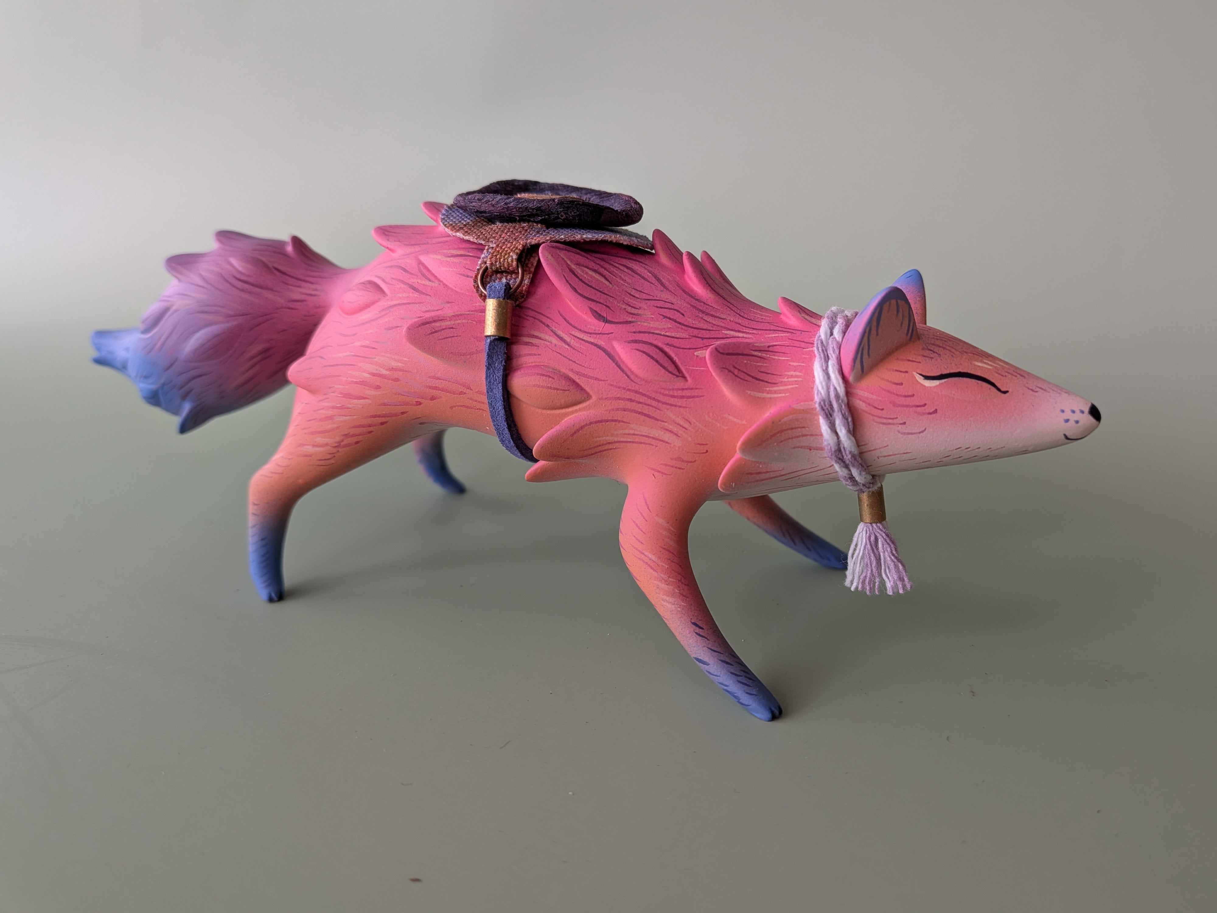 ORACLE Group Show - A Familiar Friend: Stylized fox figurine with a tassel scarf and harness, sculpted in smooth gradient, by Nimasprout x Faunwood.