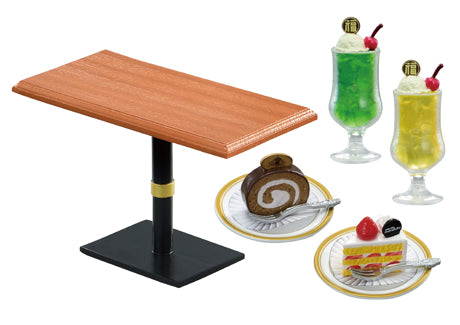 Miniature café scene featuring the Marufuku Coffee Shop Re-ment Blind Box Series with two soda floats and dessert plates, resembling a dollhouse collectible set.