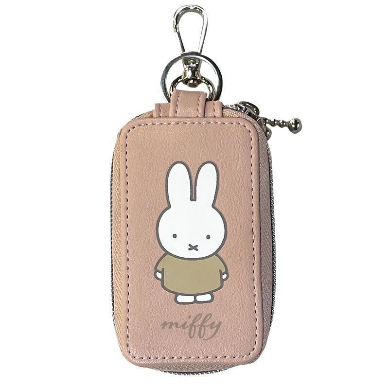 Miffy Key Case: A pinkish-beige faux-leather pouch with Miffy illustration, featuring a zipper, keyring, and dual compartments for smart and house keys.
