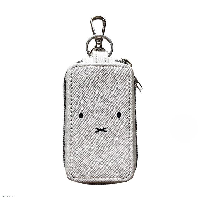 Miffy Key Case: A textured, zip-around pouch with a minimalist face design, featuring dual compartments and a key-ring clip for easy attachment.
