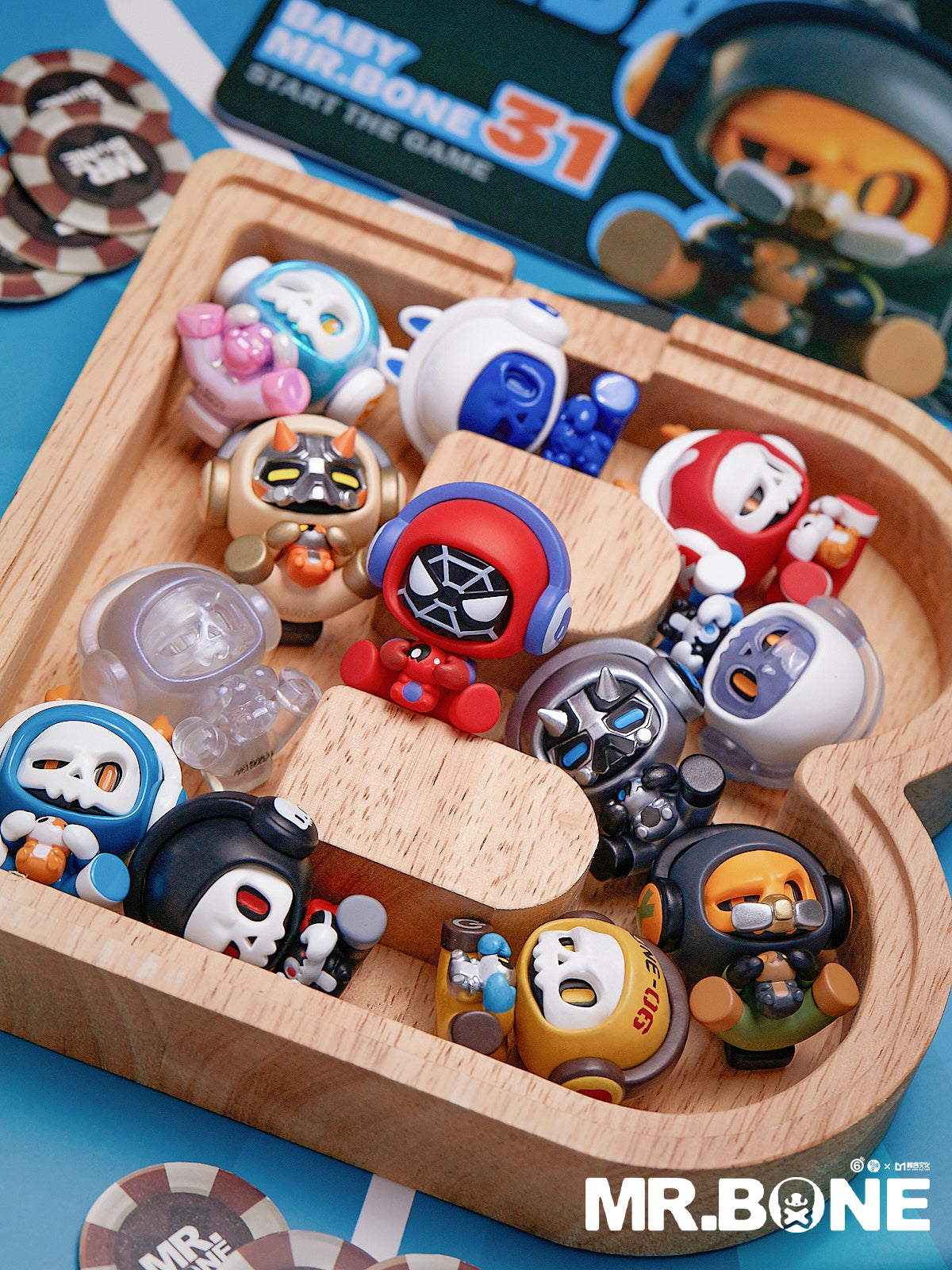 Mr Bone Baby Bone Blind Box Series showing a wooden box with small toys, including various designs, part of a collectible blind box toy collection.