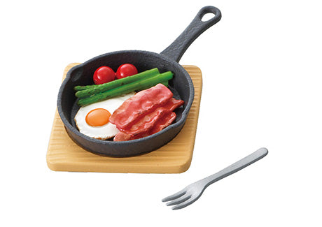Puchi Sample Light Today's Breakfast Re-ment Blind Box Series features a miniature frying pan with food, including a fried egg and vegetables.