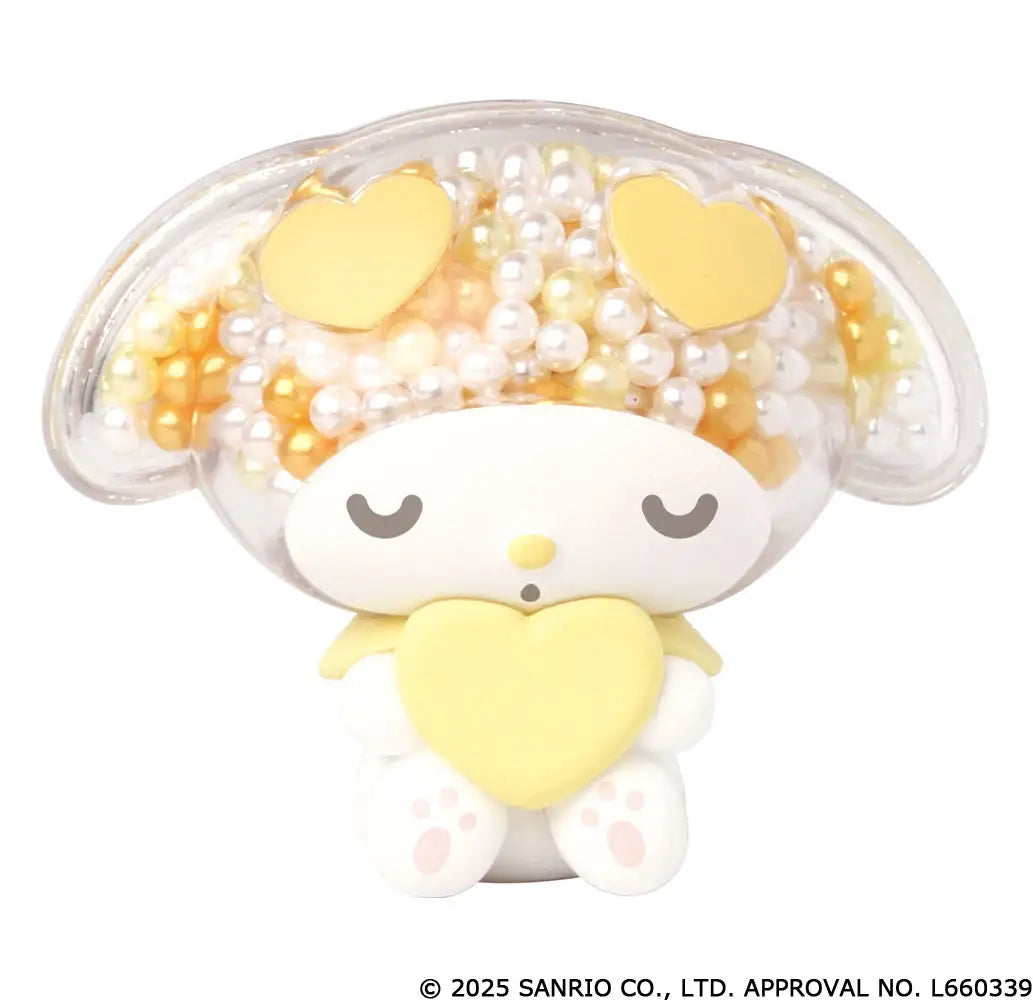 My Melody transparent sparkling mascot Gacha Series featuring a small figure holding a yellow heart, with a clear beaded bonnet and closed eyes.