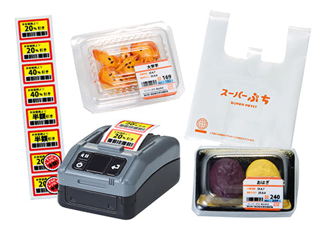 Supermarket Deli Re-ment Blind Box Series featuring discount label setup, sweet potato chunks, rice-and-red-bean treats, and Super Petit branded shopping bag.