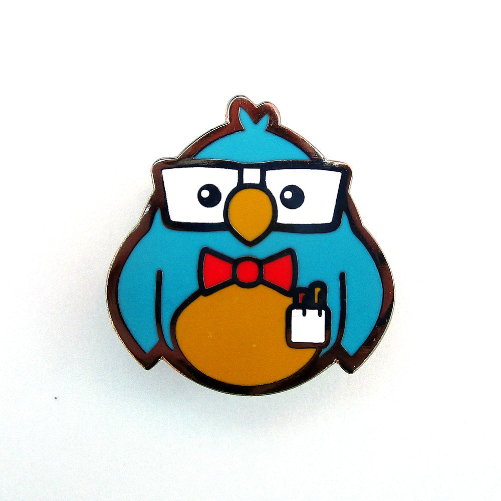 Dave Perillo Enamel Pin features a blue bird with glasses and bow tie, limited edition, 1.5 tall. Suitable for art toy enthusiasts.