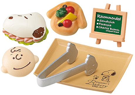 SNOOPY'S BAKERY Re-ment Blind Box Series featuring toy burger with face, wooden easel, and tongs on a tray; includes 8 designs.