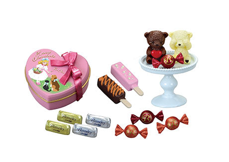 Chocolaterie Re-ment Blind Box Series: A pink heart-shaped box with assorted chocolates and candies, featuring teddy-bear and ice-cream-bar-shaped sweets.