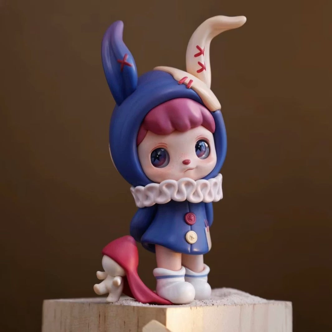 ANMOO Amo World is a Lie Fairy Tale Blind Box Series toy figurine preorder, featuring a girl in a blue hoodie. Ships May 2025.