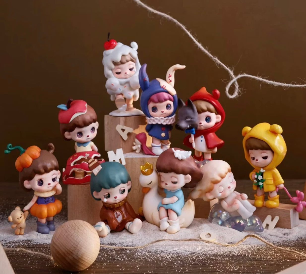 ANMOO Amo World is a Lie Fairy Tale Blind Box Series figurines on display, showcasing various whimsical girl designs. Preorder available, ships May 2025.