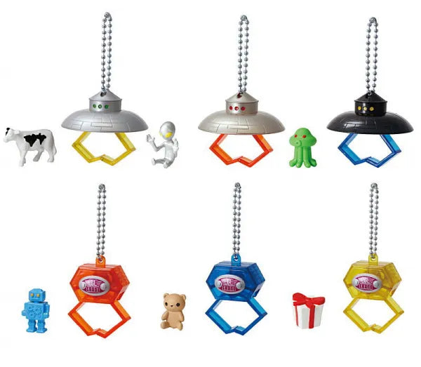 Anywhere UFO Crane Game Gacha Series featuring six key-chain toys with mini figurines, including UFOs and hex-shaped claws, part of Strangecat Toys' blind box collection.