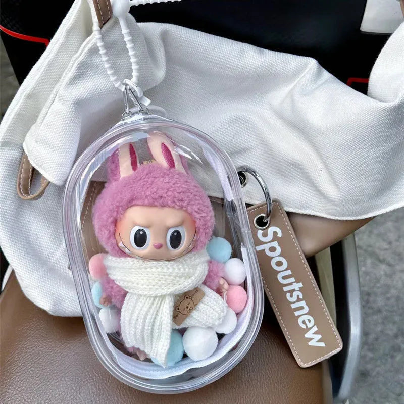 Toy Pochette Keychain 15cm in a clear bag, featuring a vinyl stuffed doll and soft balls, ideal for display or use as a keychain accessory.