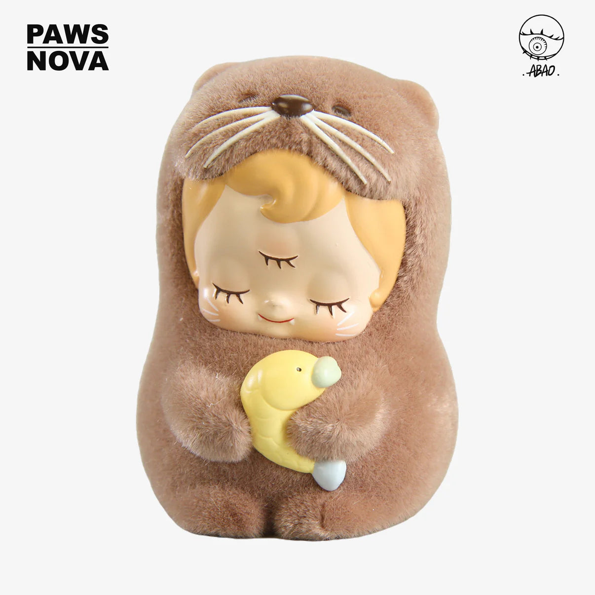 ABAO-Otter baby dede figurine with closed eyes in fuzzy otter body, holding a yellow fish. Preorder, ships Oct 2025. 7.5cm, resin and flocking.