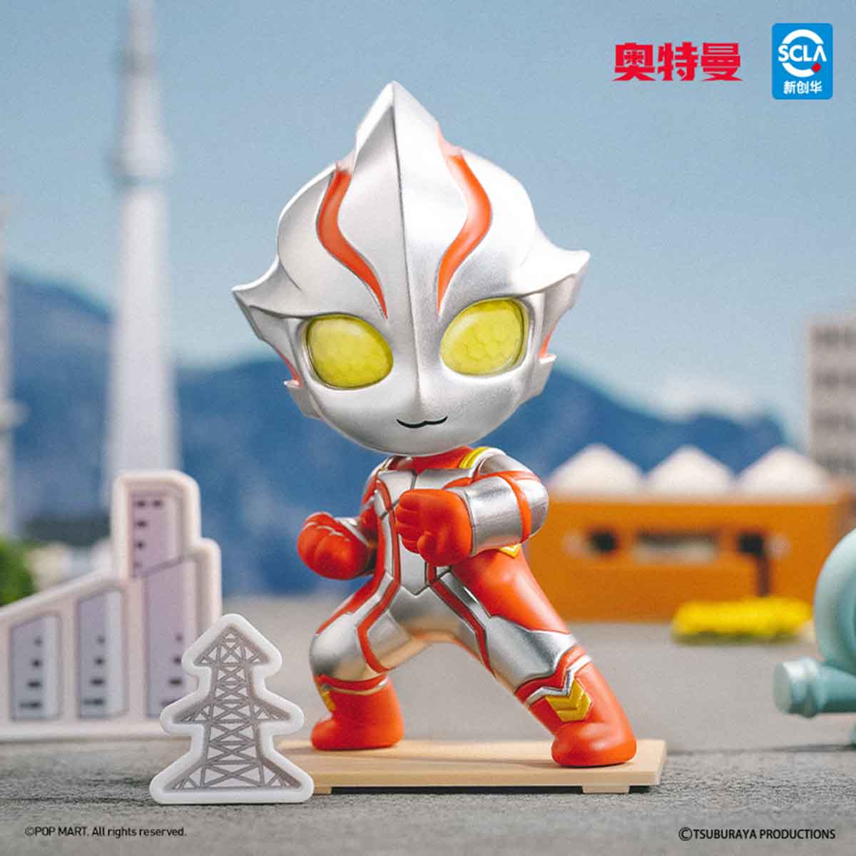 Ultraman Shooting Studio Series chibi figure by Pop Mart, crouched with power-line prop, part of a collectible set featuring 9 designs and 1 secret.