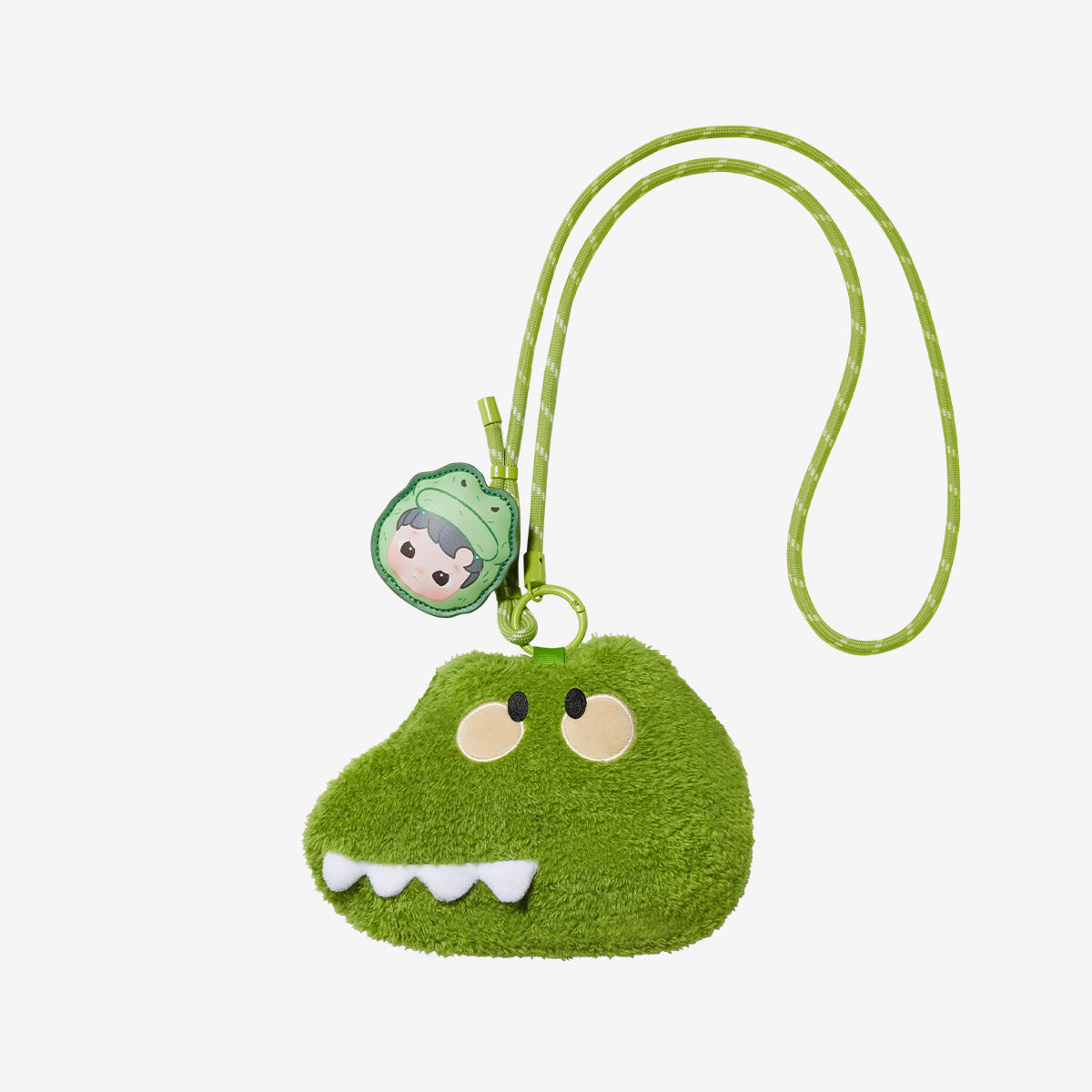 HACIPUPU Snuggle With You Series-Plush Bag Blind Box: A green, cartoonish creature cross-body pouch with felt teeth, and vinyl tag, featuring playful designs.