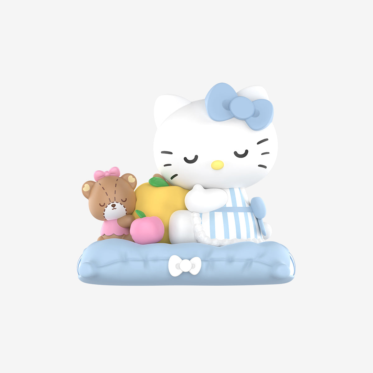 Hello Kitty and Friends Fall Asleep Series Figure featuring a cartoon cat on a cushion with a teddy bear and fruit, part of a collectible blind box.