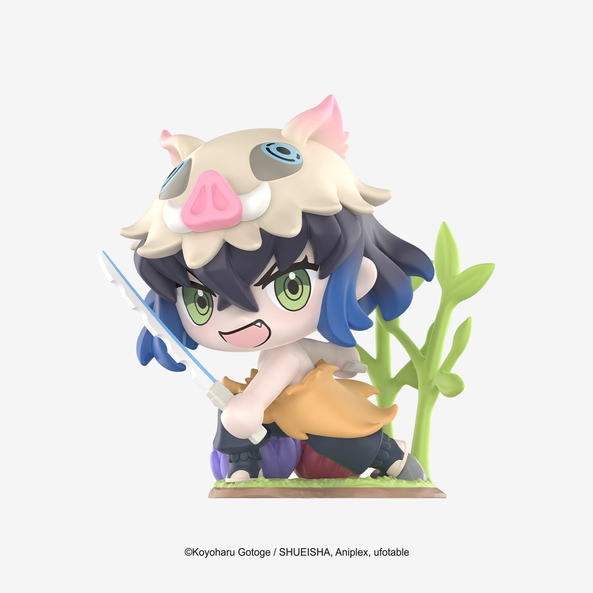 Chibi Inosuke Hashibira figure from Demon Slayer Birth Flower Series, wearing boar mask and fur, dual blades, on foliage base, officially licensed collectible.