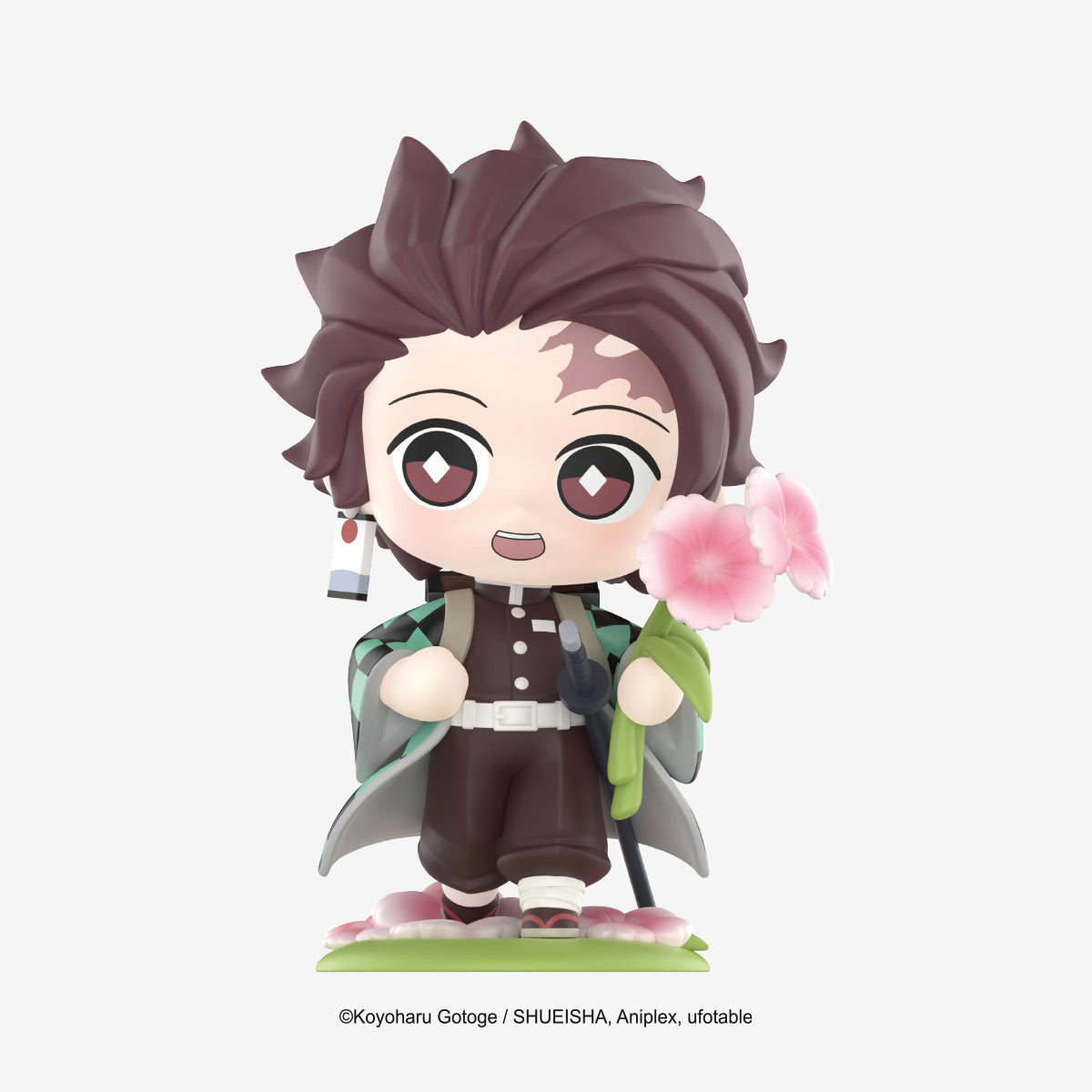 Chibi Tanjiro Kamado figure from Demon Slayer: Kimetsu no Yaiba Birth Flower Series, holding cherry blossoms, part of a collectible series with 12 designs.
