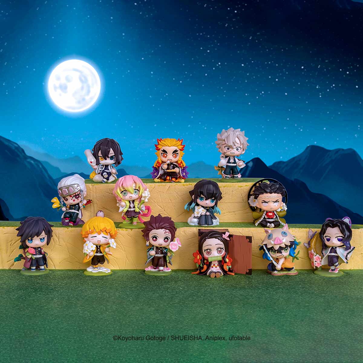 Chibi-style Demon Slayer: Kimetsu no Yaiba Birth Flower Series Figures on display, featuring main characters and Hashira, in a super-deformed style.