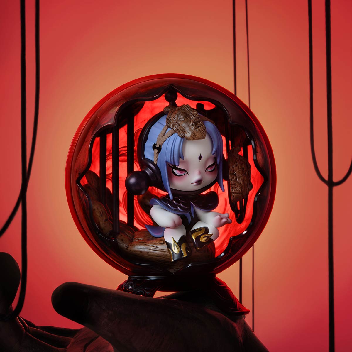 SKULLPANDA The Mirage Series Mini Bag featuring a toy figurine in a red sphere, part of a collectible series with 9 designs and 1 secret option.