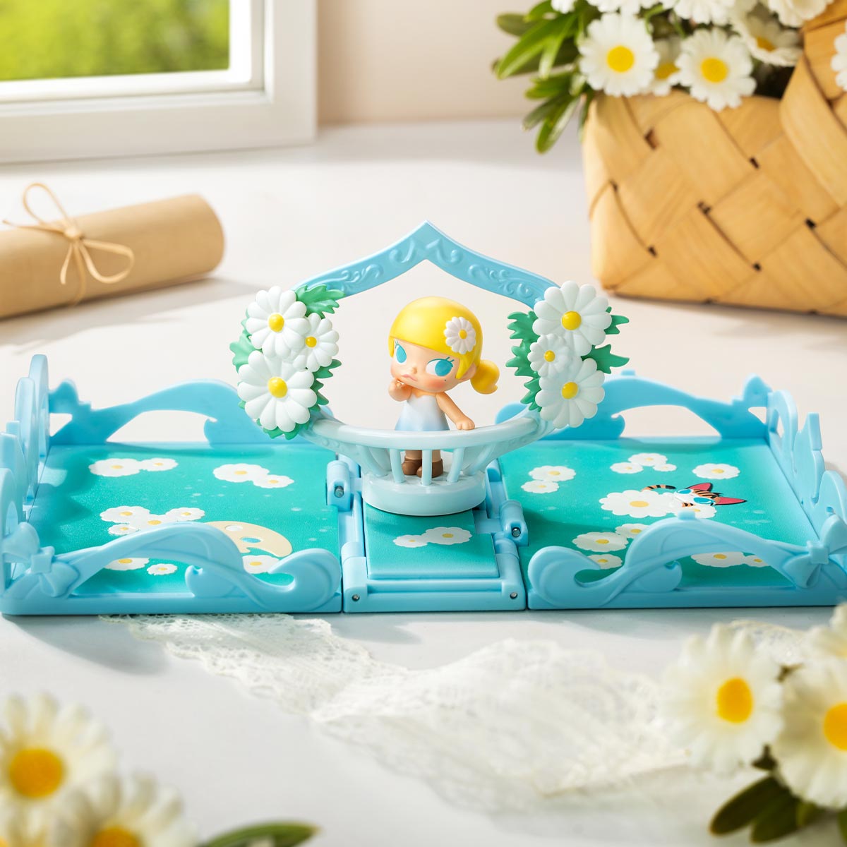 Sky-blue playset from the Gift For You Greeting Card Series Scene Sets featuring a blonde figurine under a daisy arch, surrounded by flowers.