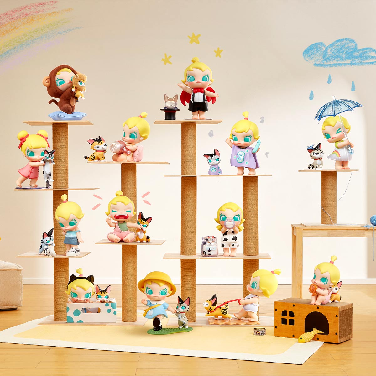 Baby Molly & Baby Tabby Series Figures displayed on a multi-tiered cat tree, featuring 12 collectible toddler figurines with tiny cartoon cats in whimsical scenarios.